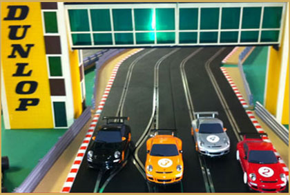 Scalextric hire at a corporate event with guests racing